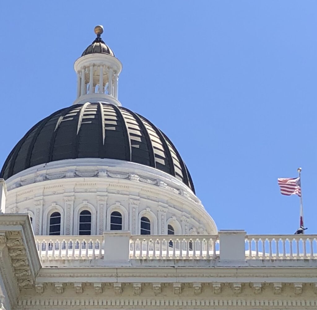 Dome atop California State Capitol Building emphasizing gold ball